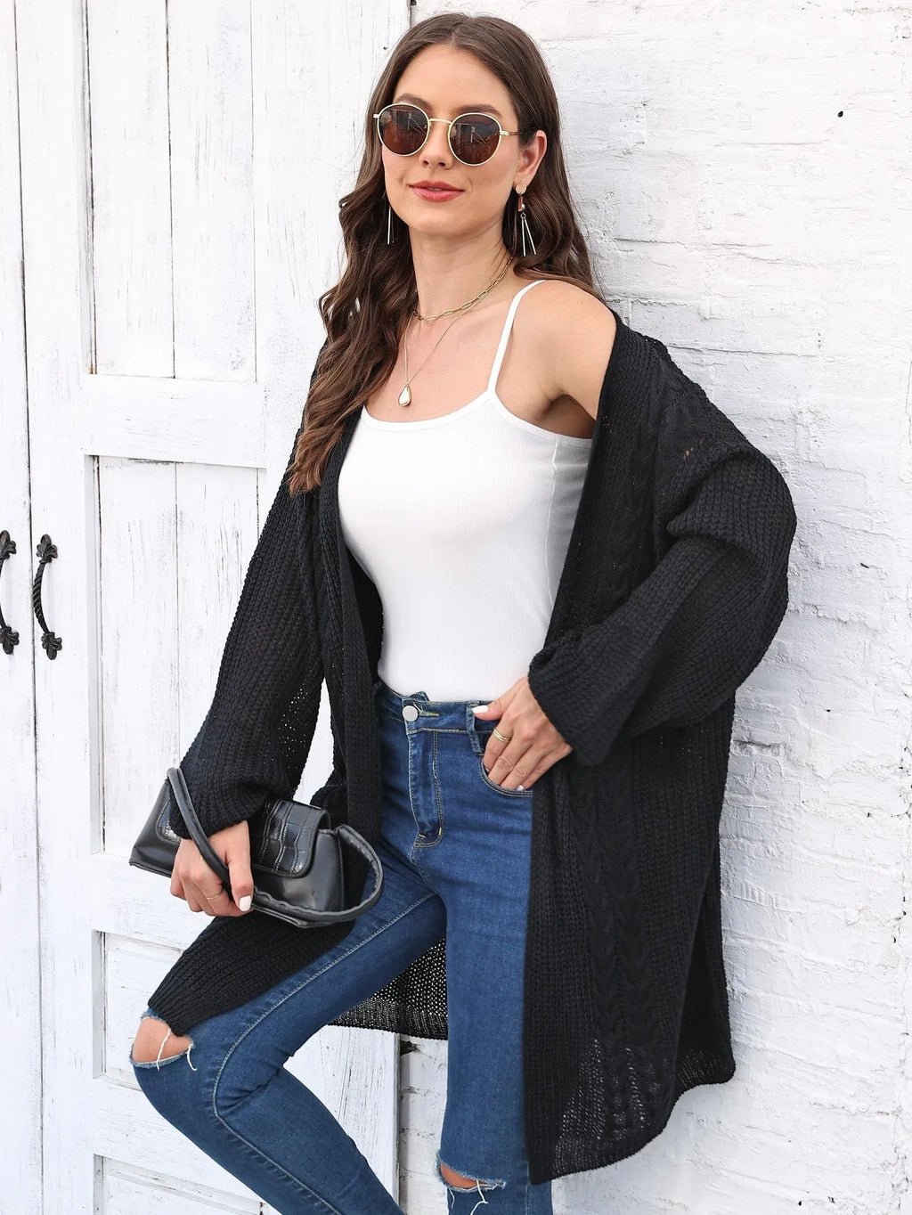 Women's loose brown acrylic sweater coat showing front detail and casual fit.