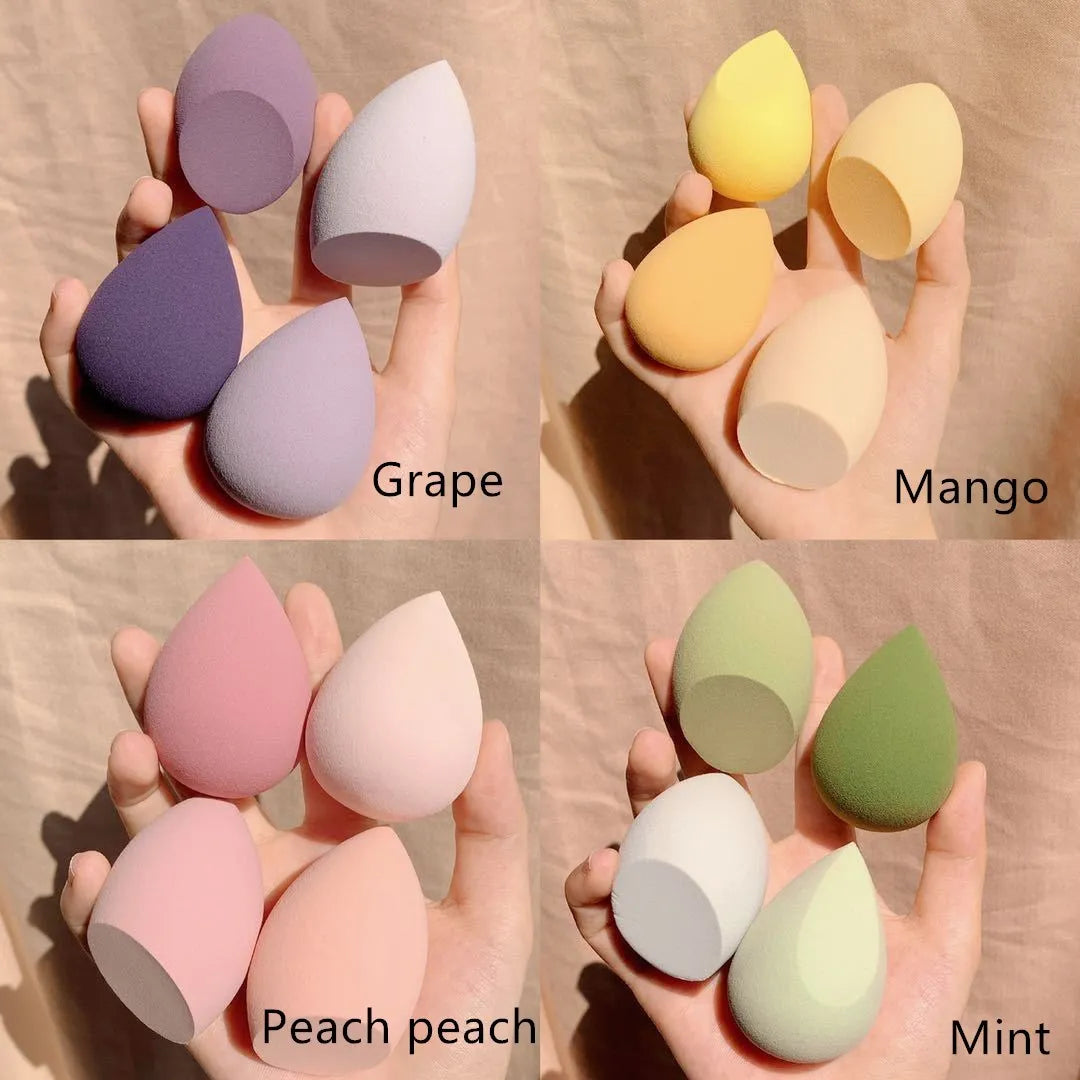 Makeup sponge egg box with four 6cm synthetic beauty sponges in grape, mango, mint, and peach colours