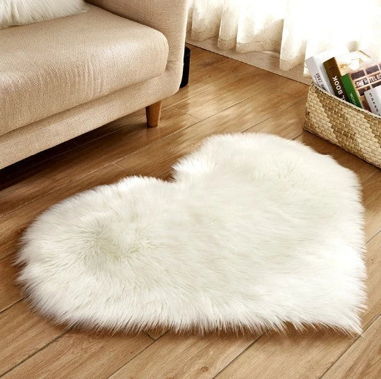 Soft, plush heart-shaped rug in various colors and sizes for comfortable home decor