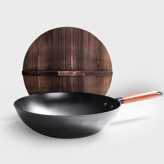 Traditional black iron wok pan with wooden handle measuring 40x32x10cm