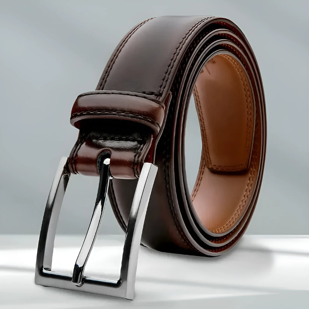 Men's brown genuine leather belt with 95 grain texture and alloy metal buckle laid flat.