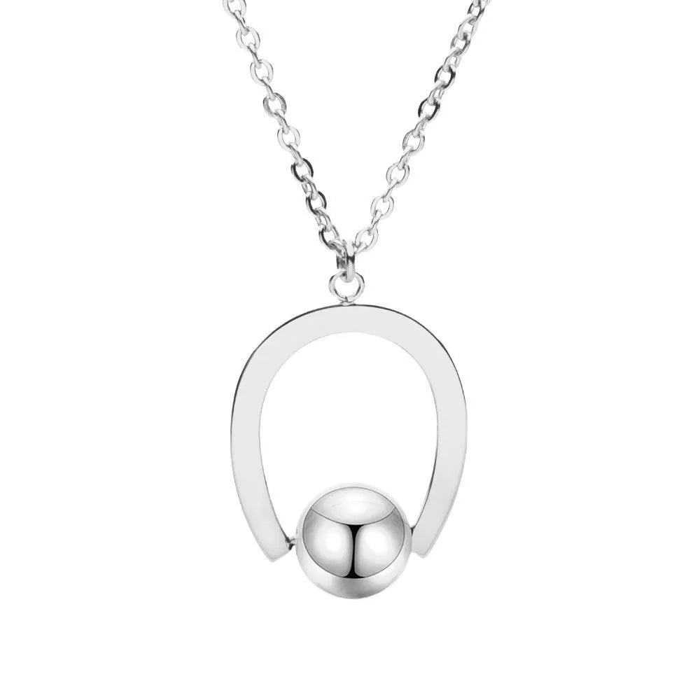 Stainless steel necklace with geometric pendant on a cross chain, shown in gold colour.
