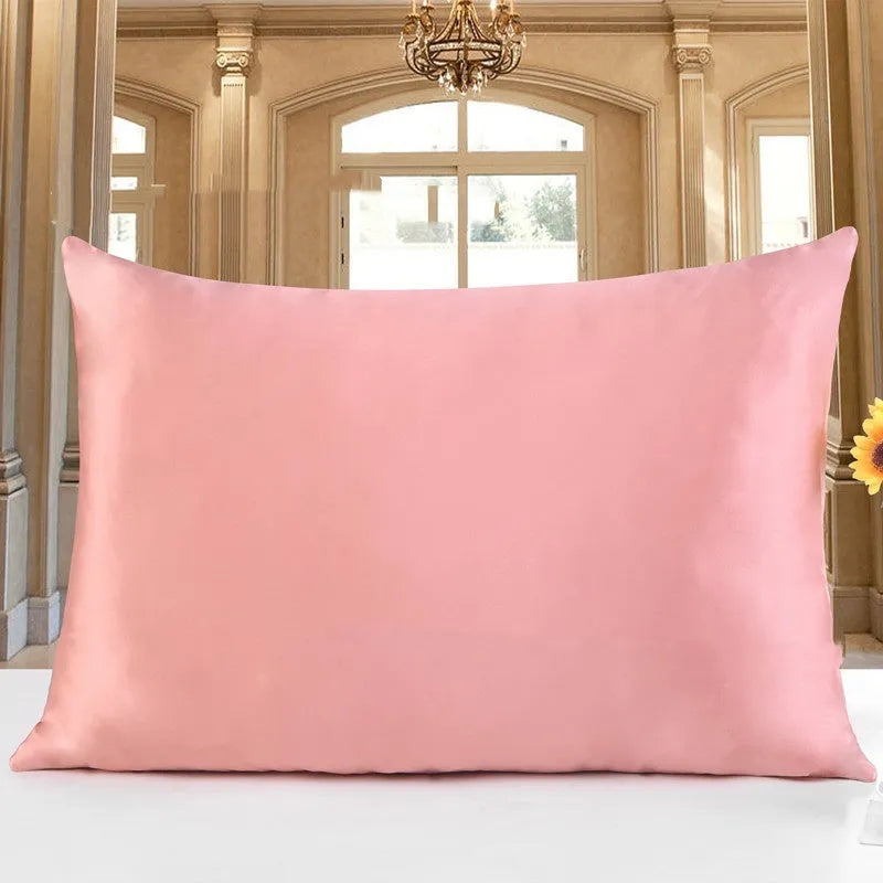 19 M double-sided silk pillowcase shown in one of 14 colours, including apricot, champagne, and navy blue.