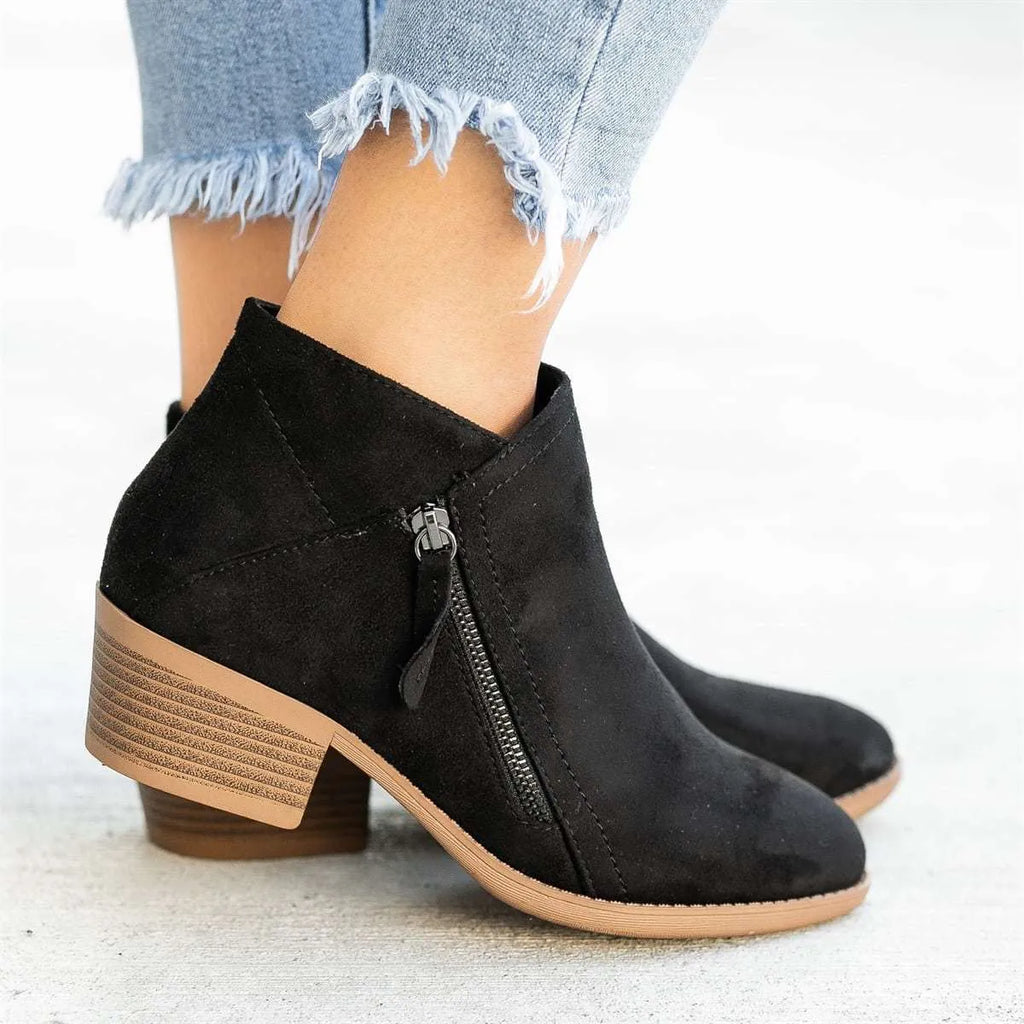 Women's suede chunky heel ankle boots with side zip in blue, shown from the side.