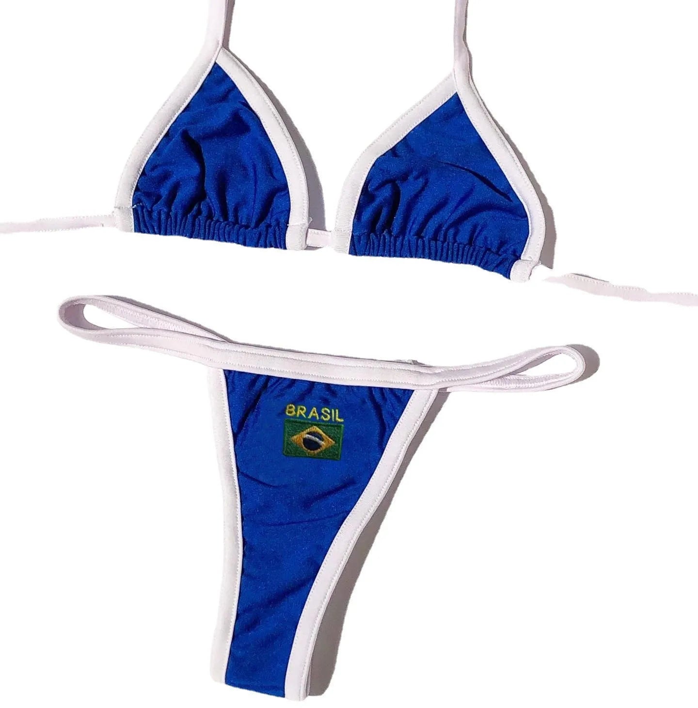 Women's yellow polyester T-back bikini with shorts-length pants on a beach background