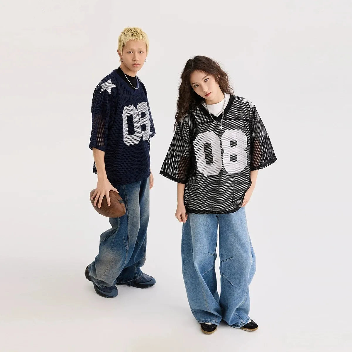 Black loose fit half sleeve pullover shirt with white letter print pattern.
