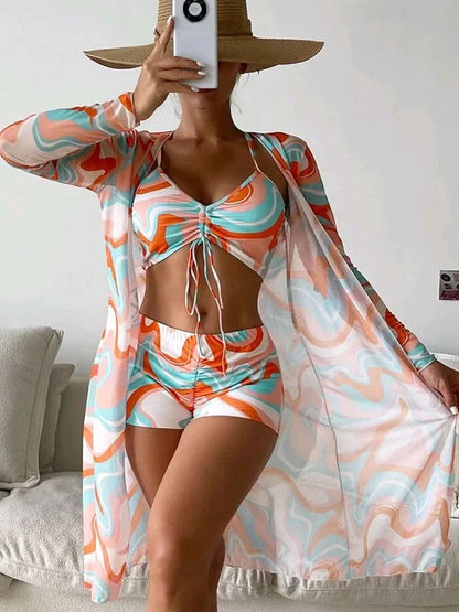3-piece Pring bikini set with long sleeve cardigan in floral pattern for summer beach outings