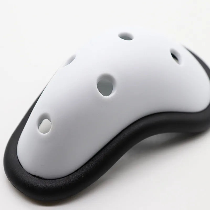 Black rubber sports genital protector for adult and child sizes used in hockey, rugby, and martial arts.