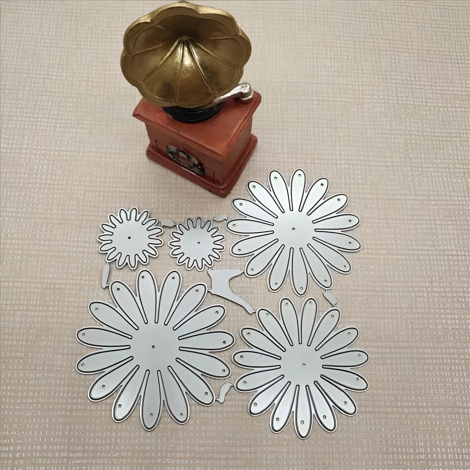 Silver high carbon steel cutting mold with etched flower decoration measuring 12.5x13 cm