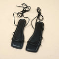 Women's flat sandals with ankle wrap strap and square toe in black, white, and orange colours.