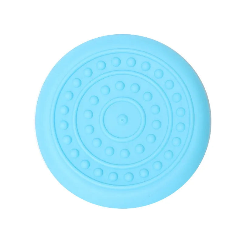 Rubber dog frisbee toy in green colour, showing soft plastic construction suitable for throwing and catching games with pets