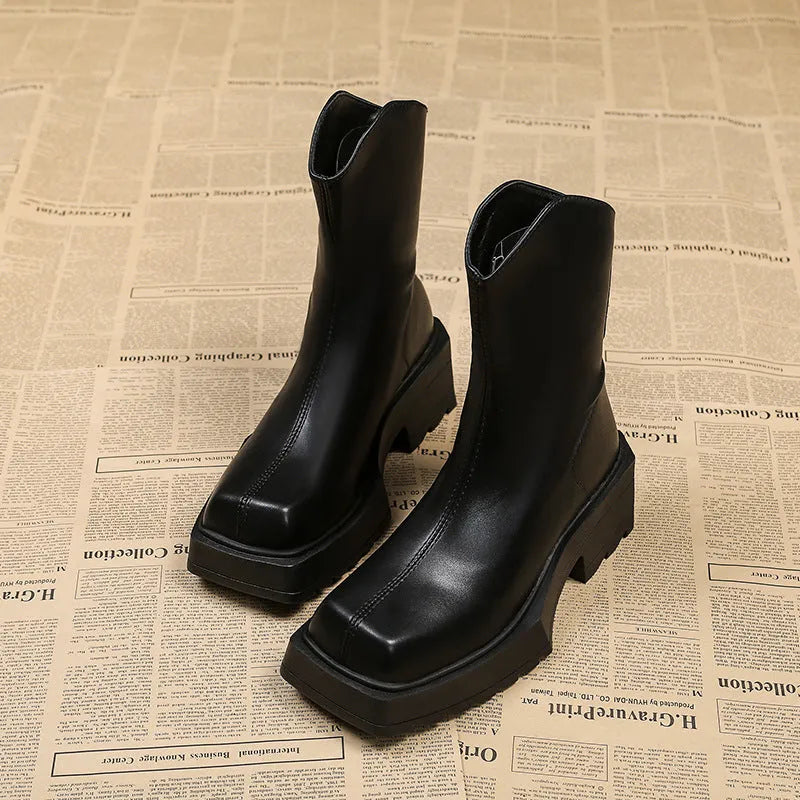 Women's black platform Martin boots with square toe and back zipper, showing 6-8cm heel