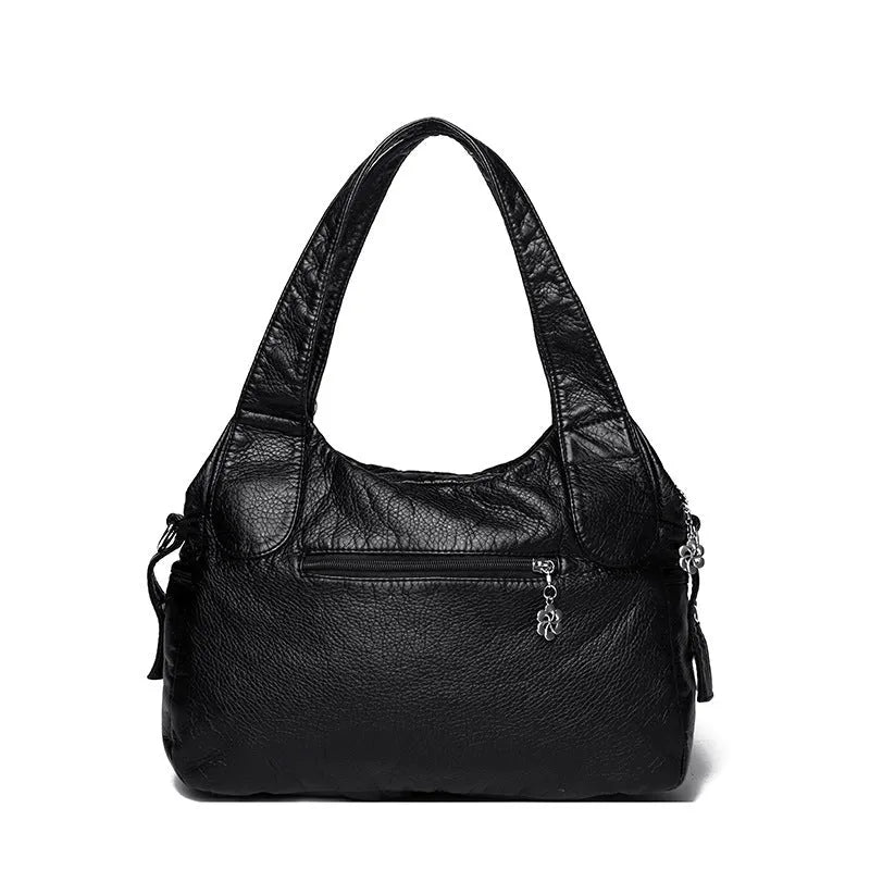 Women's large capacity washed leather handbag in soft PU, black colour, with slit pocket and sewn thread detailing