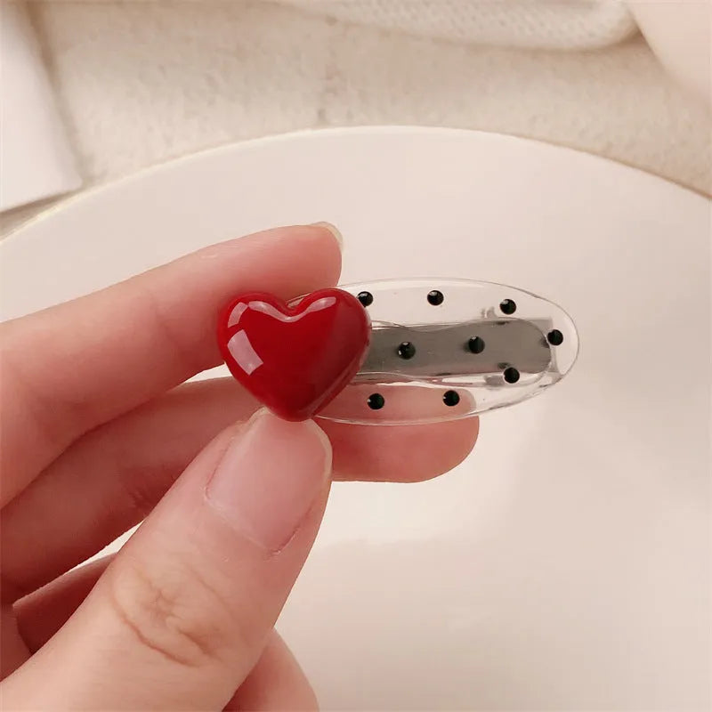 Red stereo love heart-shaped hair clip with French retro dots and willow leaf design.