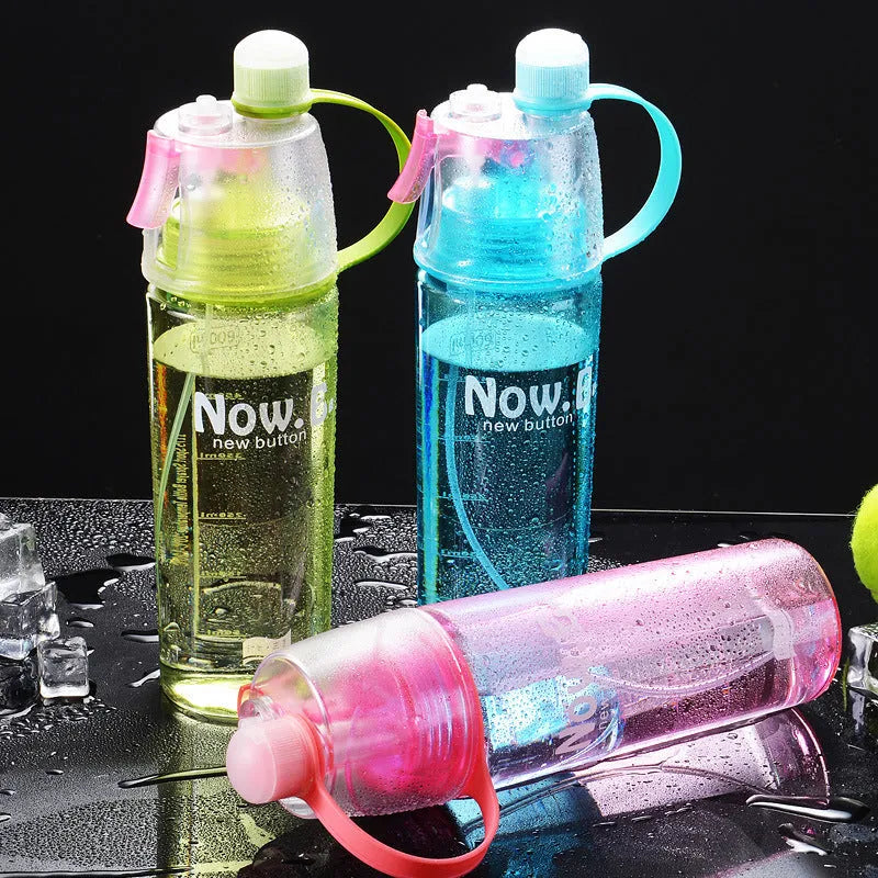 Green portable outdoor mist spray cup with handle, leakproof pad, and visible water level scale.