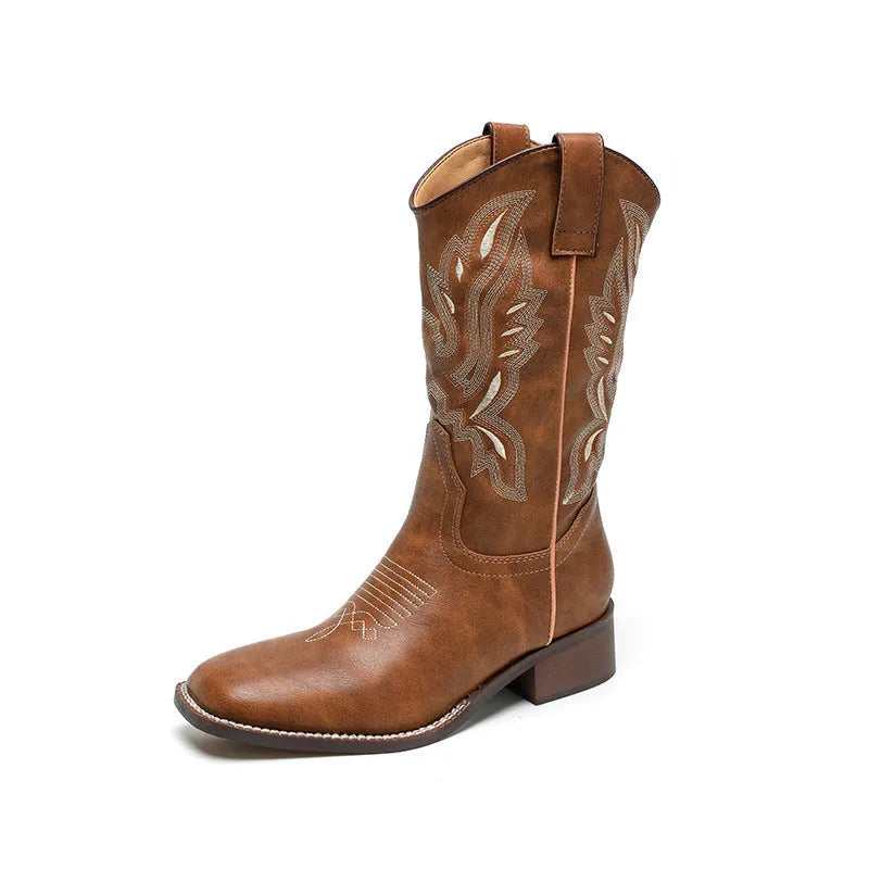 Brown leather women's mid-calf Martin boots with embroidered totem pattern and a waterproof platform sole.
