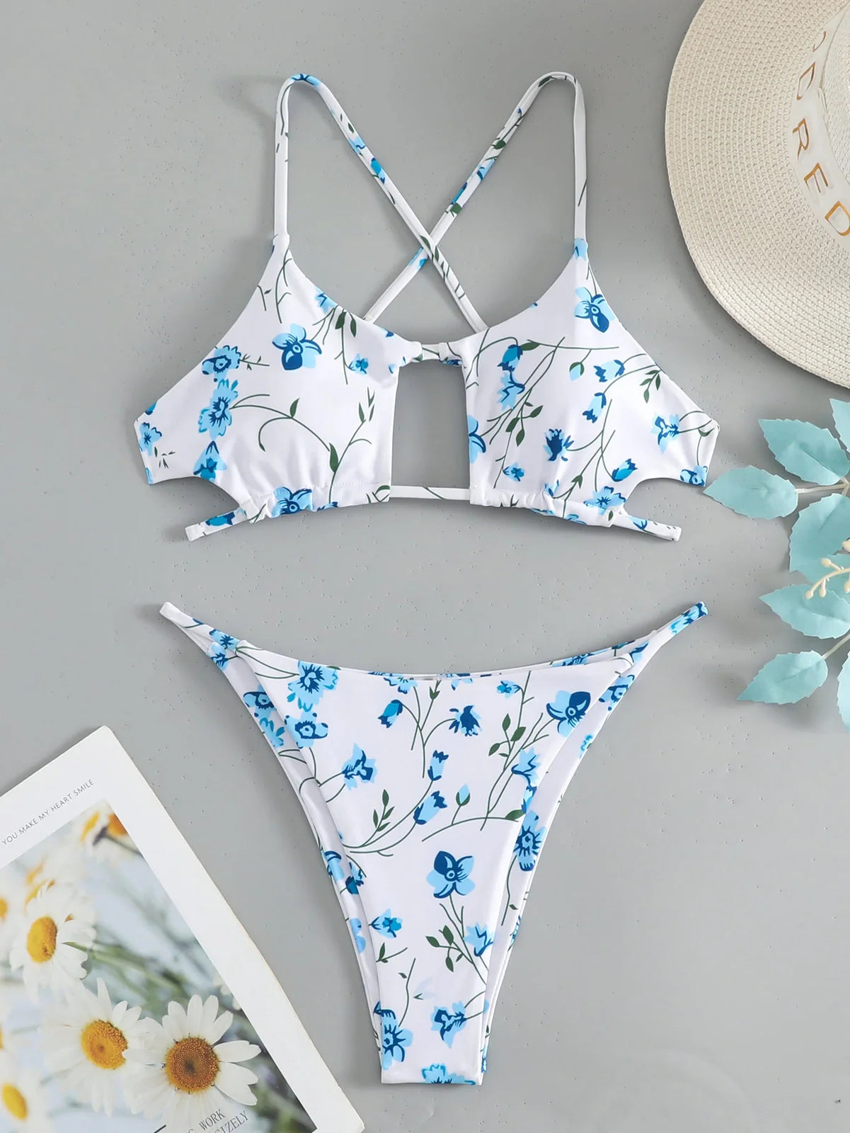 Women's floral pattern tie-neck triangle swimsuit with matching shorts on mannequin