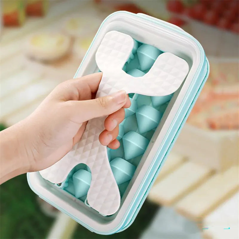 Silicone ice ball mould bottle in light grey, showing integrated ice tray and bottle with lid.