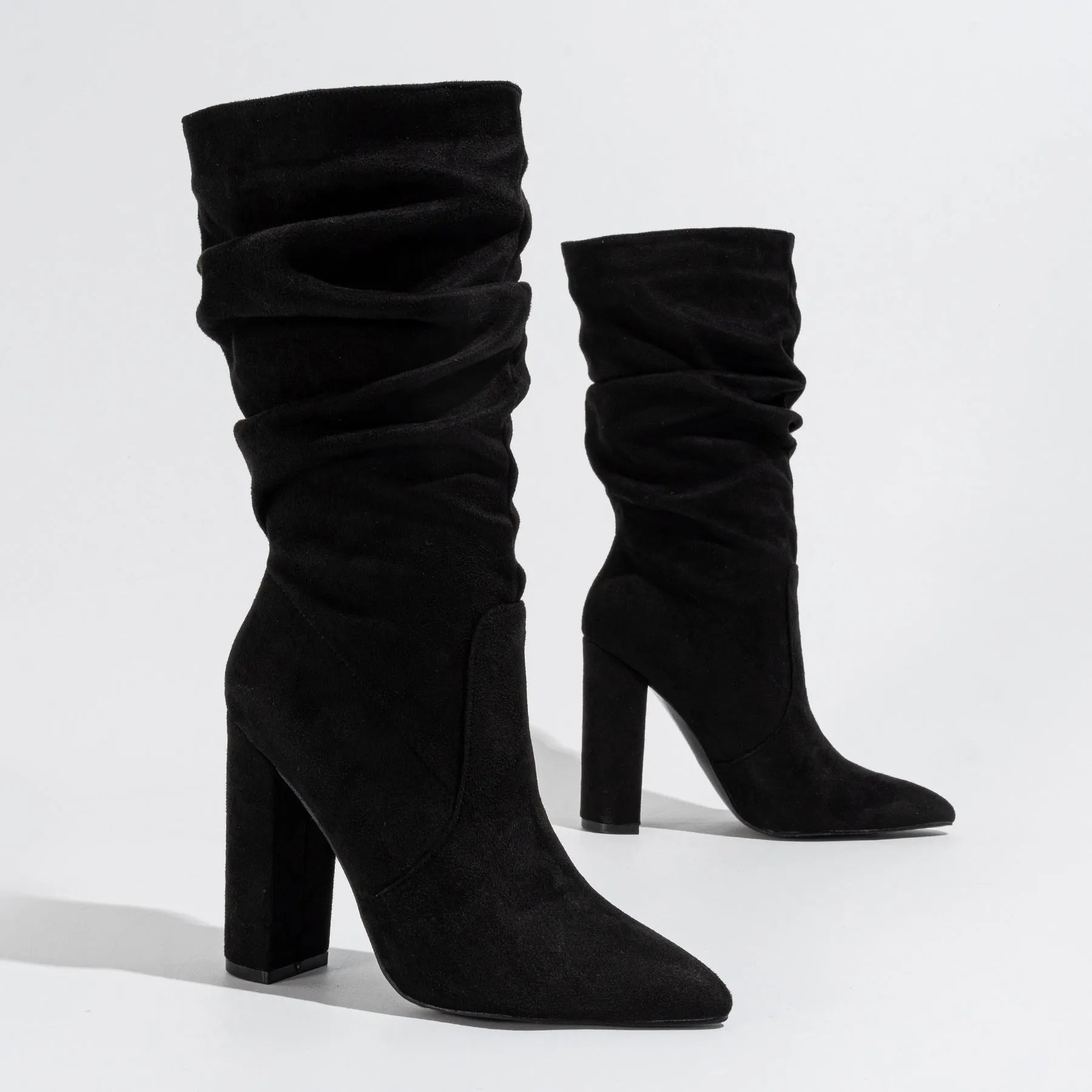 Women's black suede pointed-toe boots with chunky heel and mid-calf length