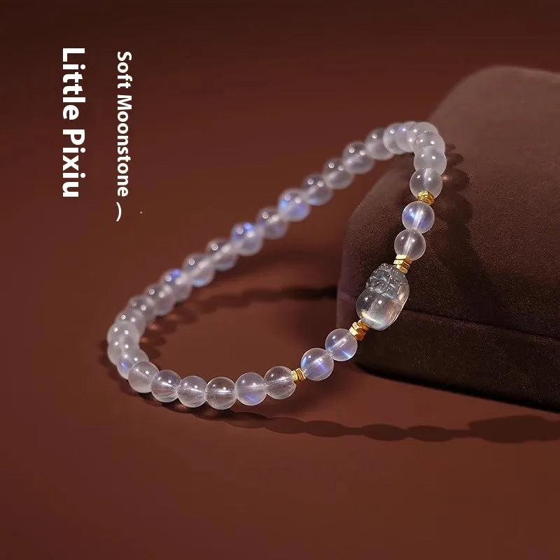 National style moonstone bracelet with animal zodiac design showing blue light fashion effect