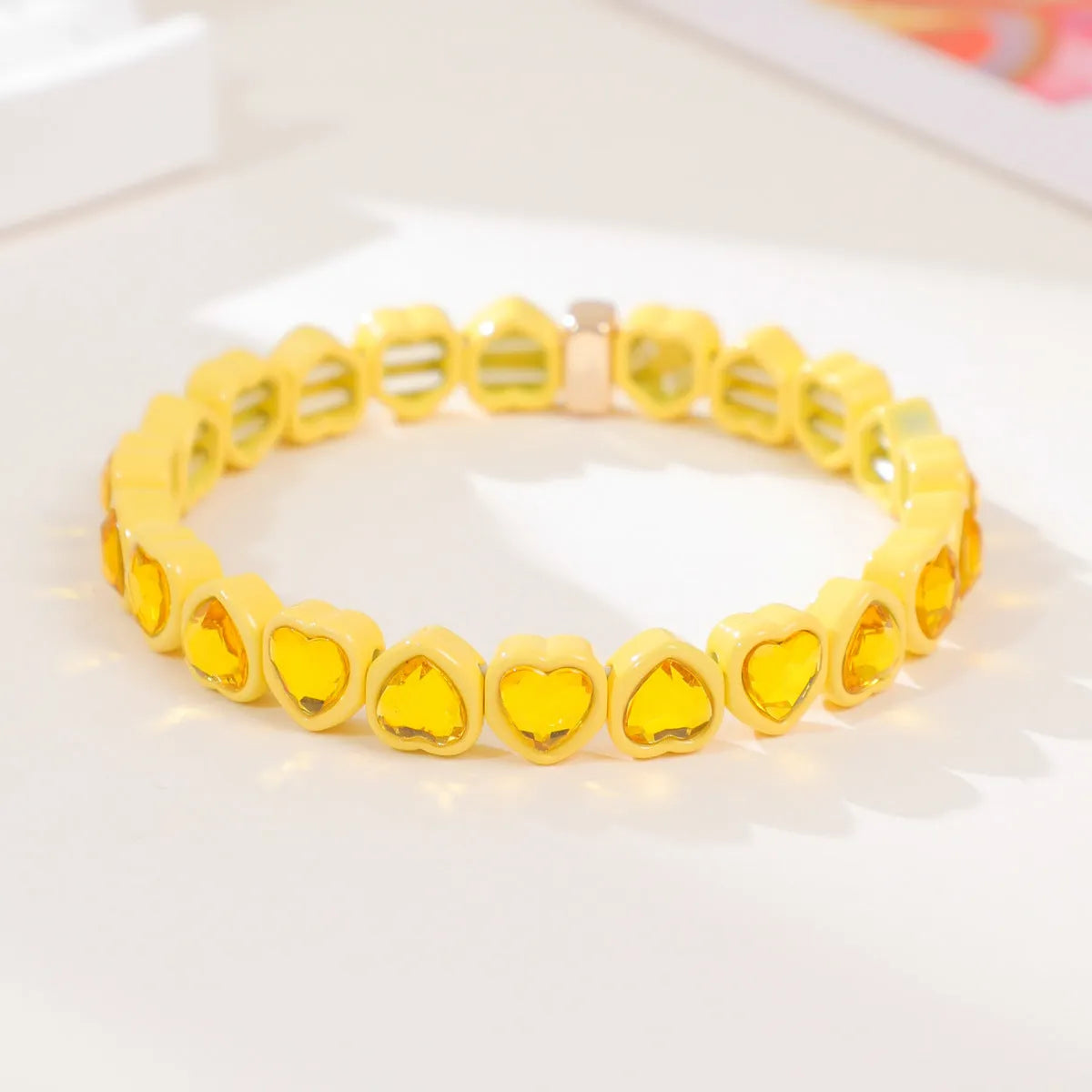 Rainbow enamel alloy heart stretch bracelet showing colourful pattern and heart charm