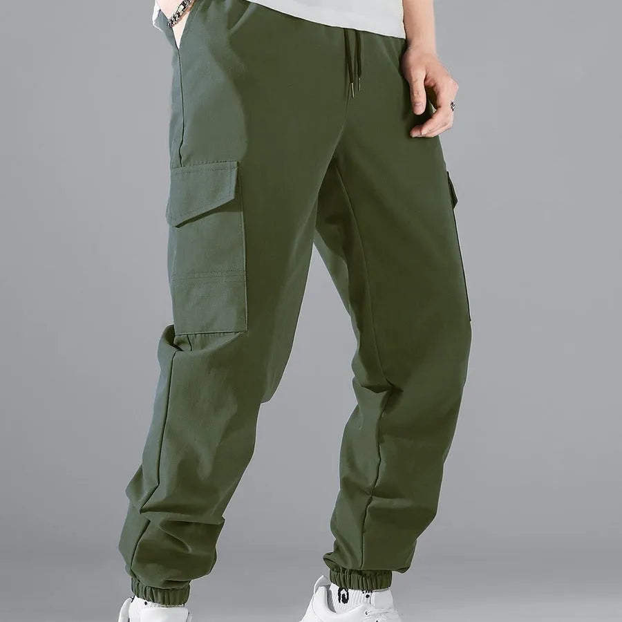 Men's multi-pocket workwear trousers in army green with drawstring waist, side and back pockets, straight leg cut
