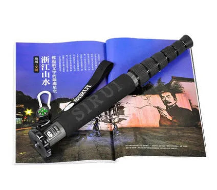 Black carbon fibre SLR camera monopod shown collapsed and extended.