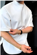 White men's cotton T-shirt with a round hem and single button detail, shown on a model.