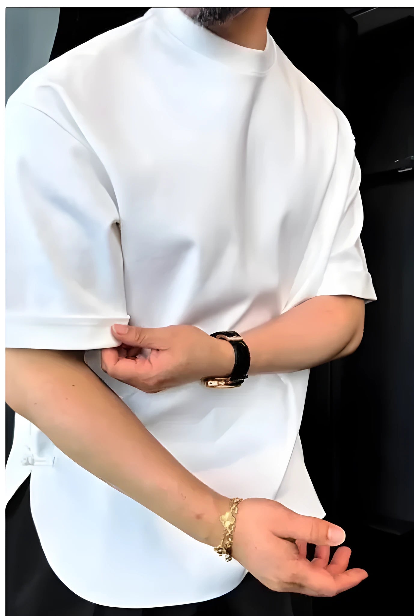 White men's cotton T-shirt with a round hem and single button detail, shown on a model.