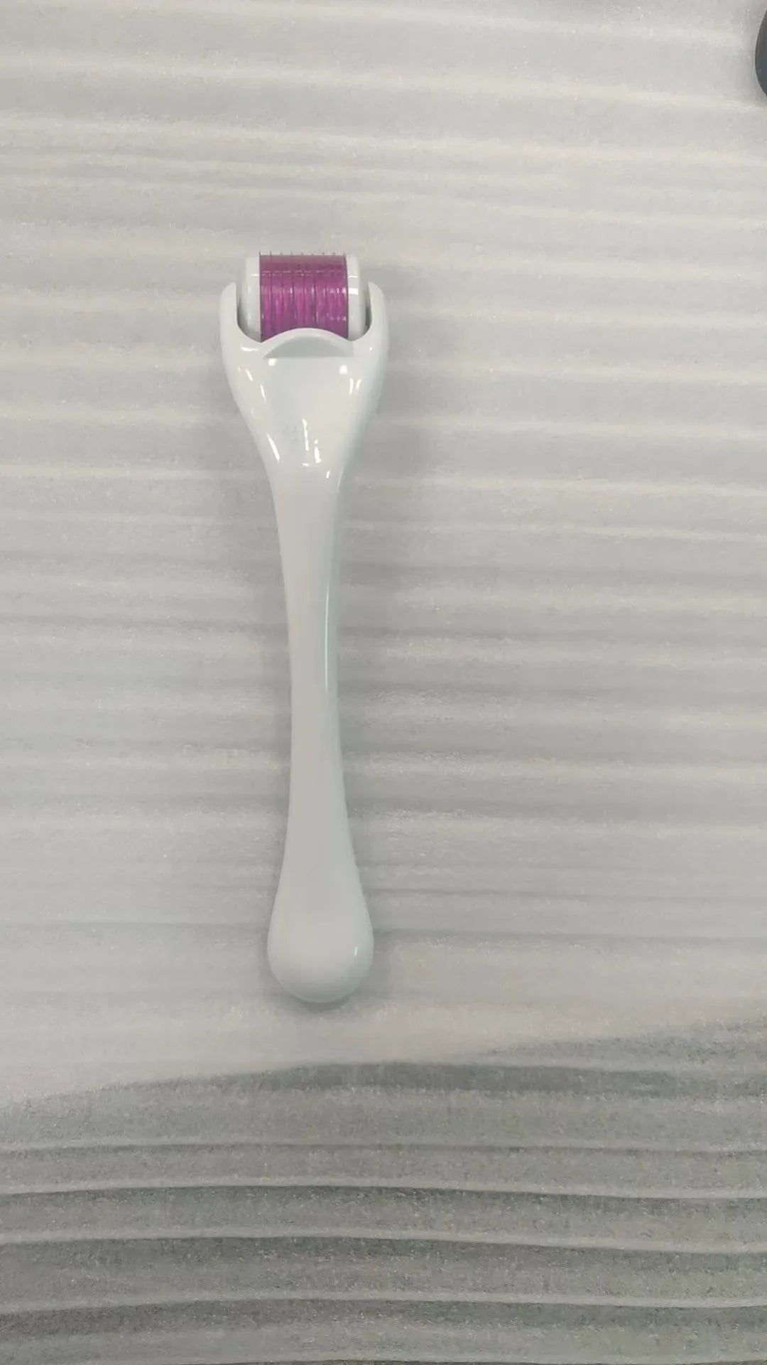 540 needle microneedle derma roller with colour wheel on black handle, showing 0.25mm specification.