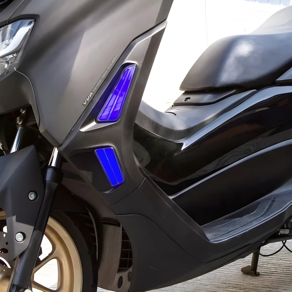 Pair of coloured LED turn signal lights for a Yamaha NMAX155 motorcycle on a white background.