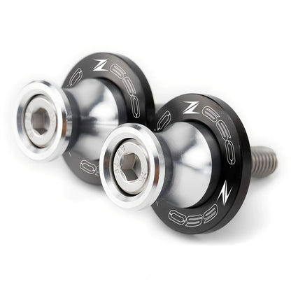 Pair of 8mm CNC aluminium swingarm spools sliders in titanium for Kawasaki Z650 Z900, with Delrin contact and stainless bolts
