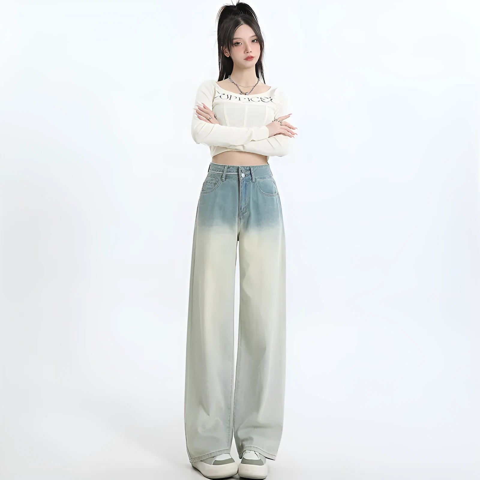 Women's gradient blue straight-leg wide leg cotton denim trousers laid flat.