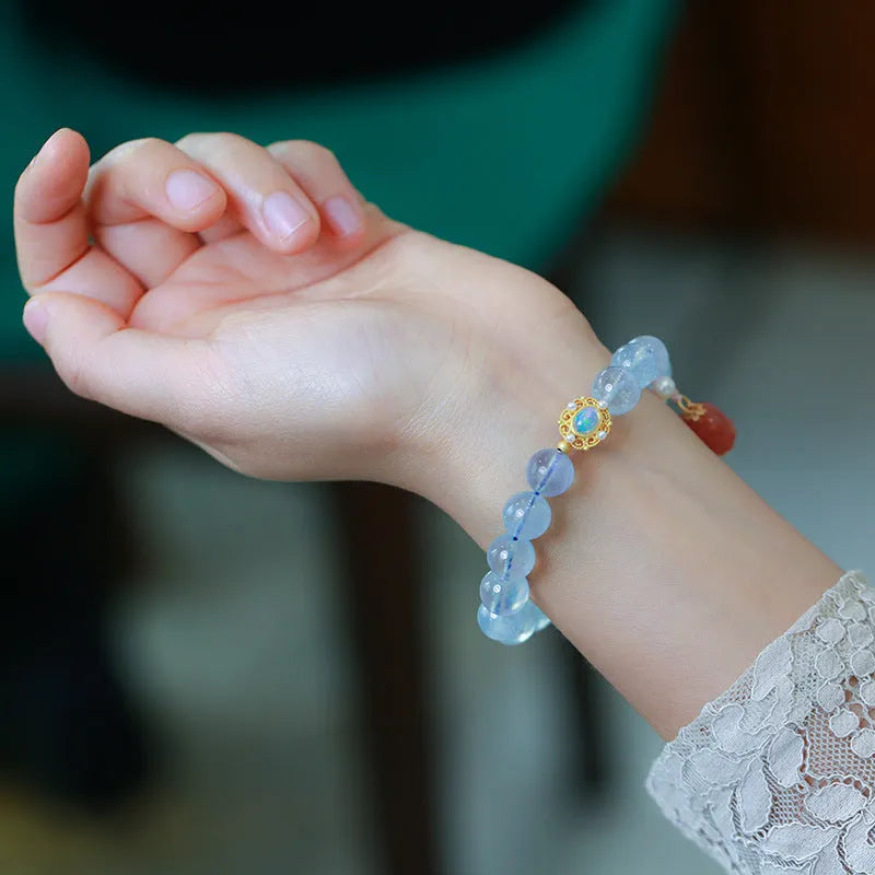 DIY aquamarine bracelet kit with Chinese Fengjiu fox design and pink crystals.