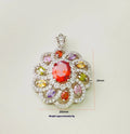 Close-up of a women's flower-shaped zircon pendant necklace in a gold tone on a model.