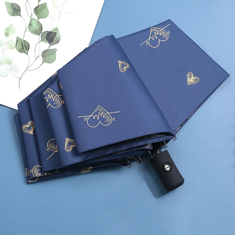 Dual-use automatic eight-bone bronzing feather folding umbrella with black rubber handle and NC fabric canopy