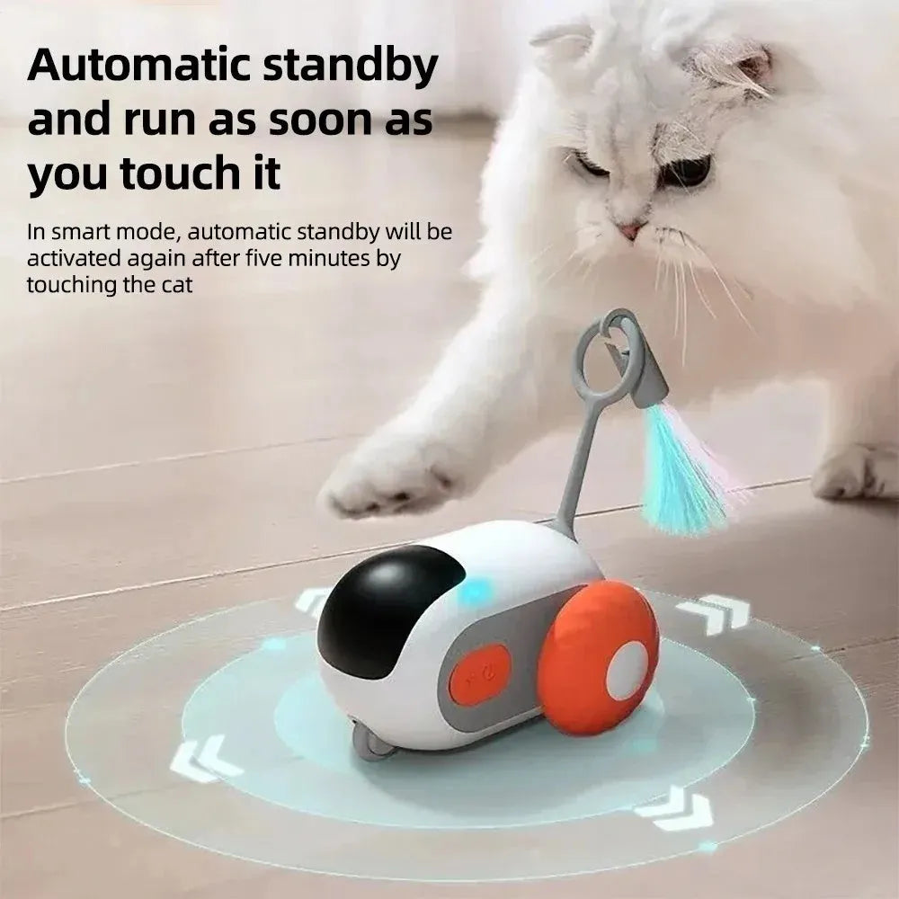 Smart electronic cat toy car with feather attachment on hard floor
