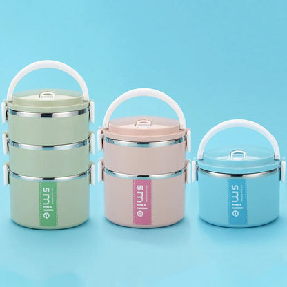 Stainless steel lunch box with built-in spoon, leak-proof design, in green, pink, and blue