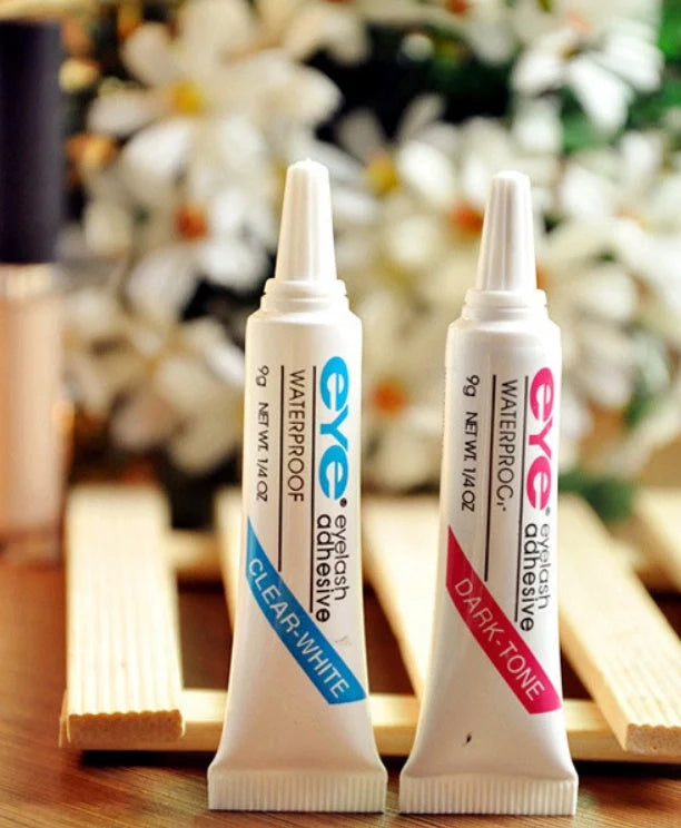 Professional false eyelash glue in black and white for natural, long-lasting eye makeup