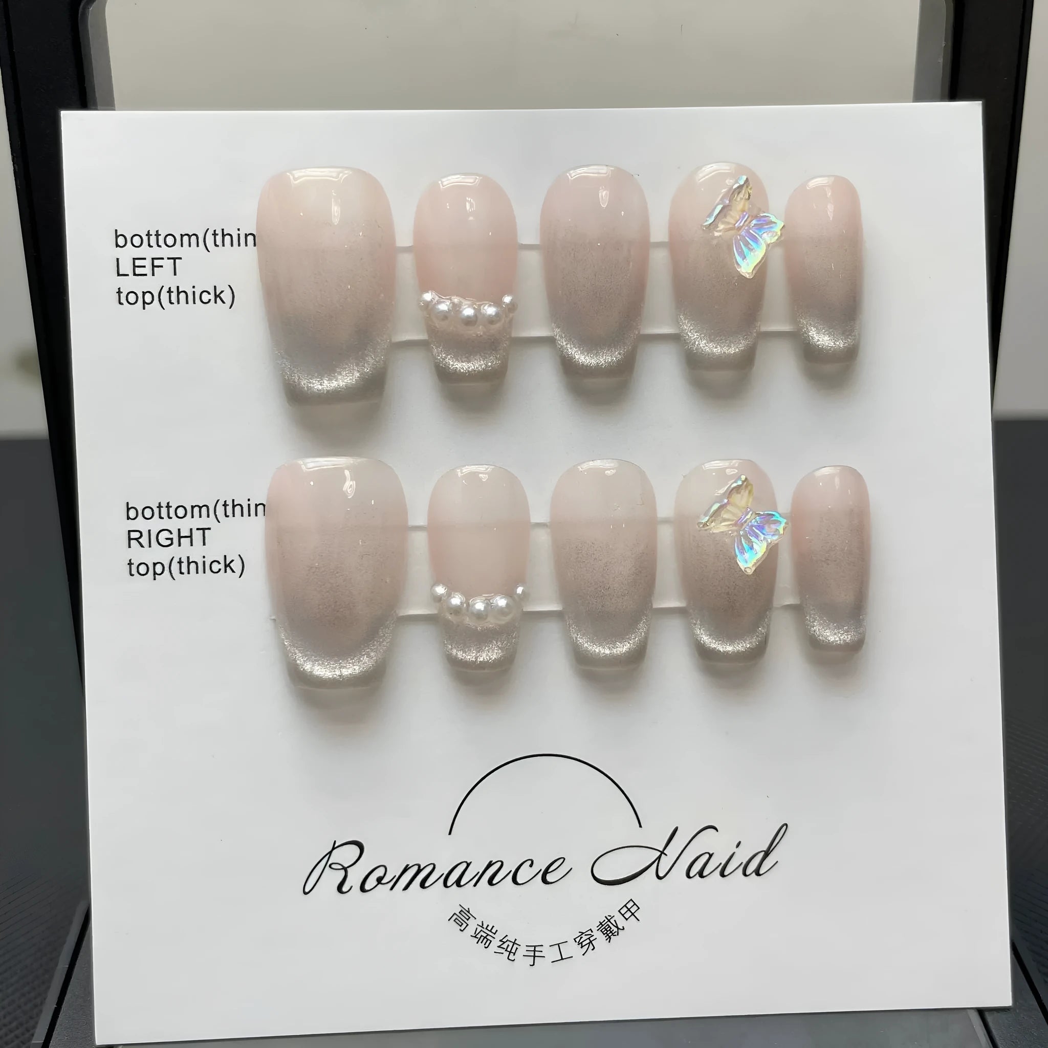 Women's handmade false nails with simple blush armour design in short length.