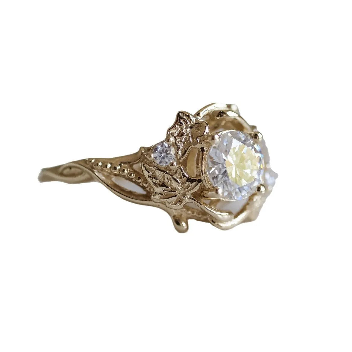 Gold alloy unisex ring with brushed finish on white background