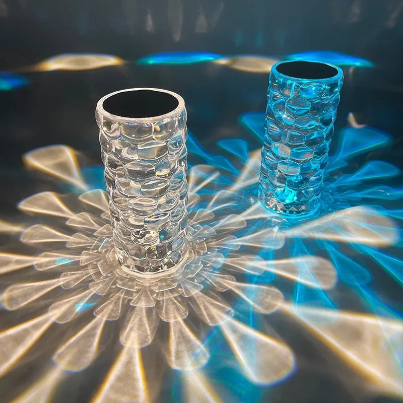 Crystal table lamp with teardrop acrylic shade showing droplet shadow effect on bedside table