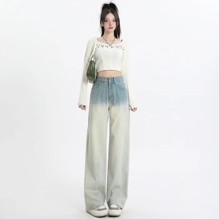 Women's gradient blue straight-leg wide leg cotton denim trousers laid flat.
