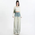 Women's gradient blue straight-leg wide leg cotton denim trousers laid flat.