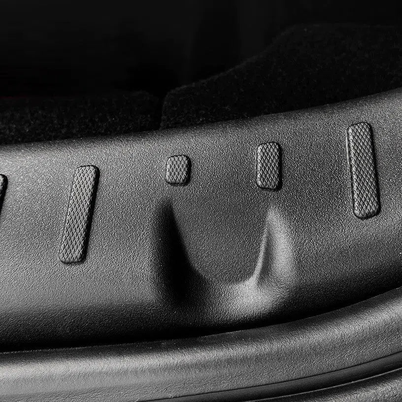 Black plastic car trunk threshold guard anti-kick pad measuring 50x15x8cm