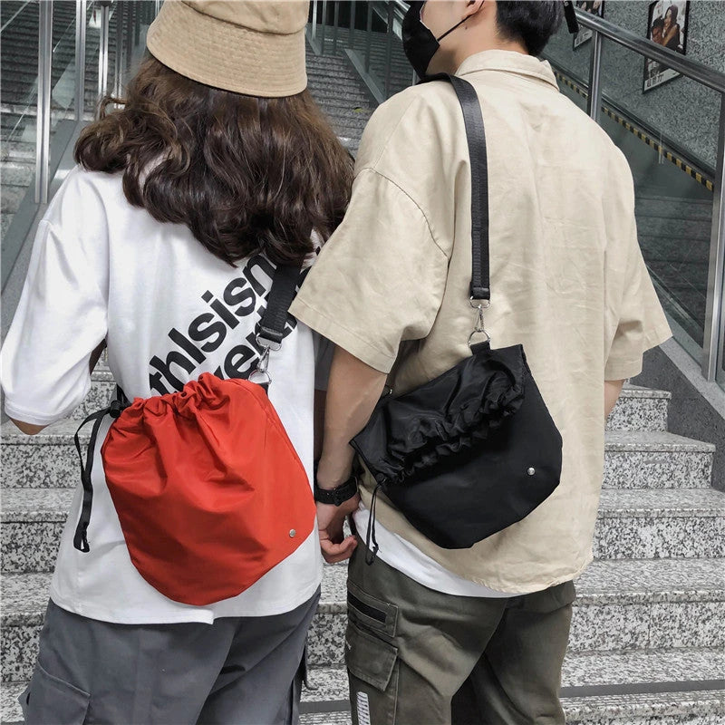 Diagonal Drawstring Fabric Waist Bag in Light Grey, Orange, and Black