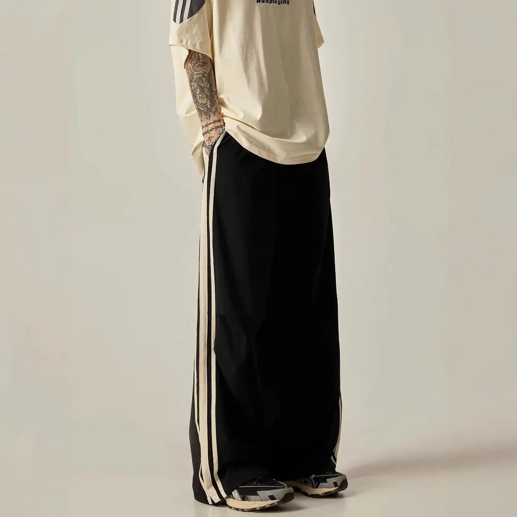 Black wide leg climbing pants for men showing high waist and straight leg design
