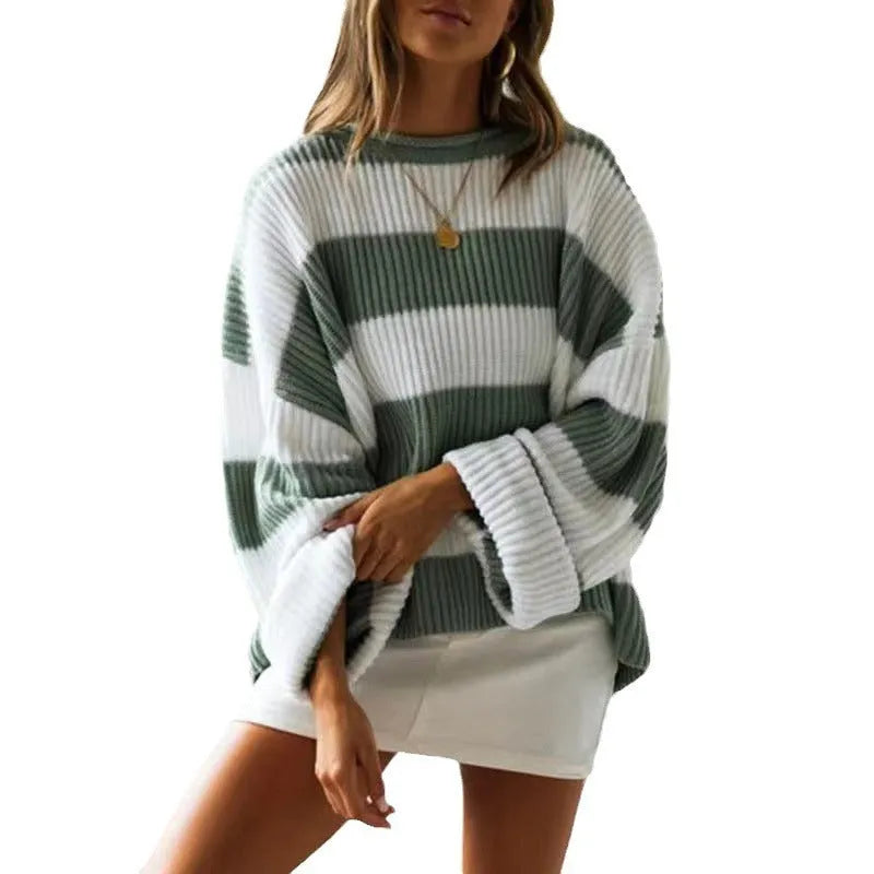 Women's loose striped sweater with long bell sleeves and white crocheted flower decoration on the front.