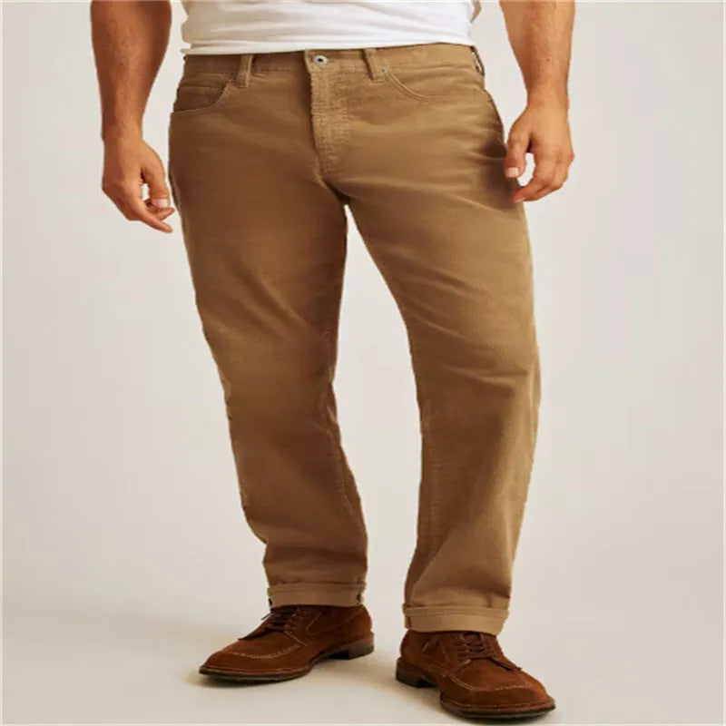 Men's solid colour corduroy trousers in a straight leg, loose casual fit on a hanger.