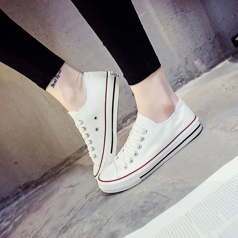 Women's solid colour casual canvas shoes shown in black, white black, white red, and all black options.